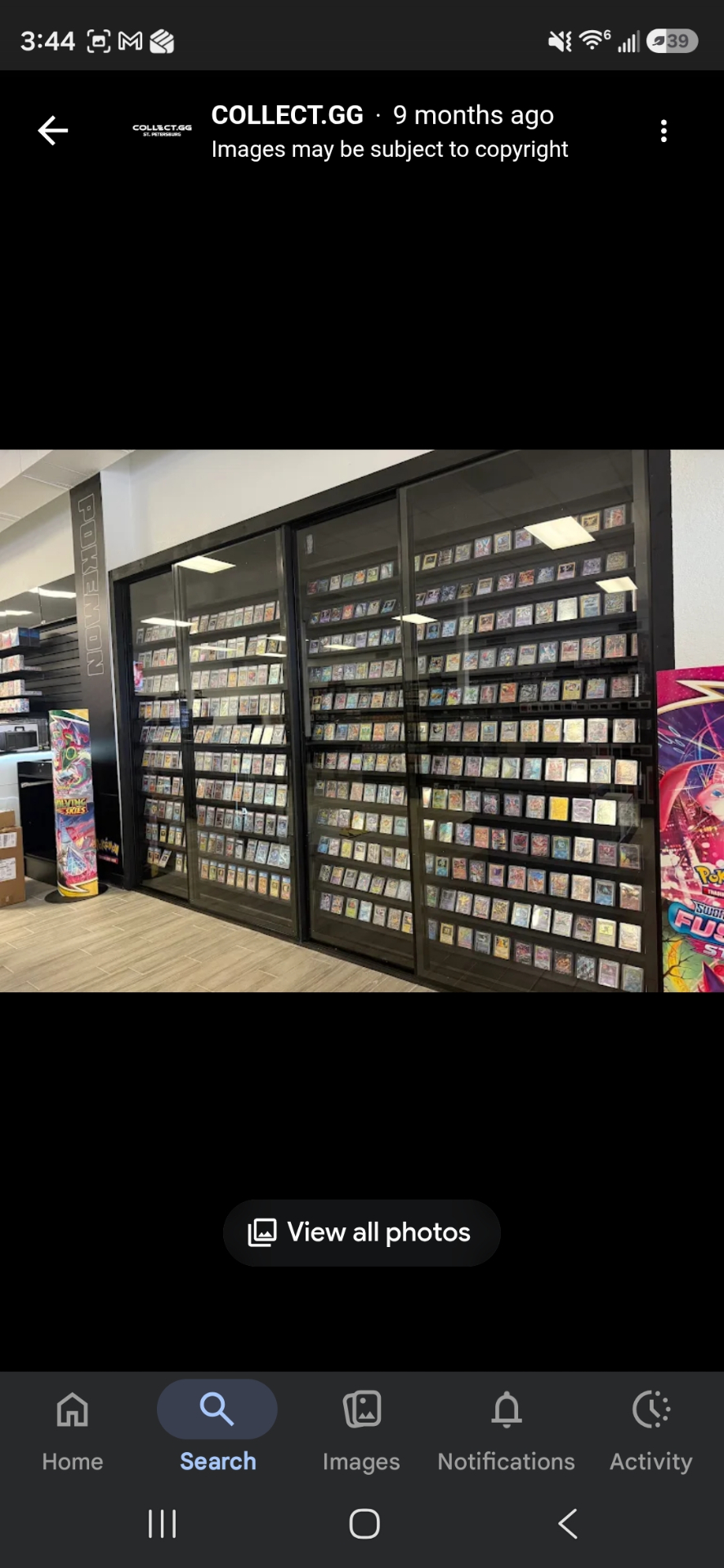 Wall of graded Pokémon cards in display cases